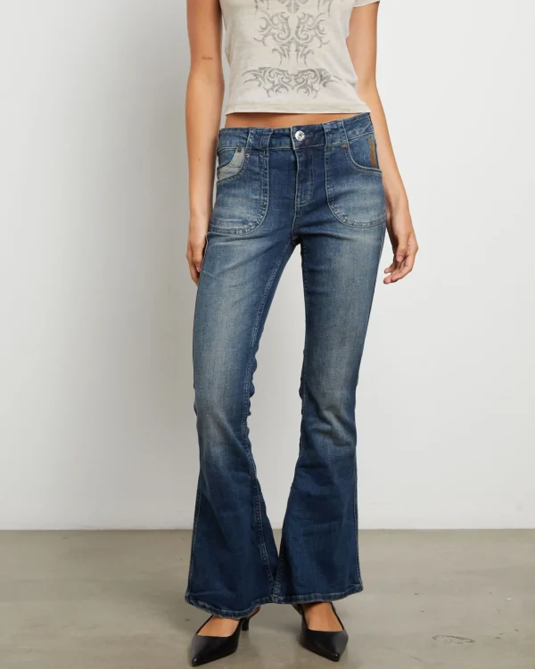 Shop BDG URBAN OUTFITTERS Bdg Tiana Low Rise Flare Jeans In Dark Vintage