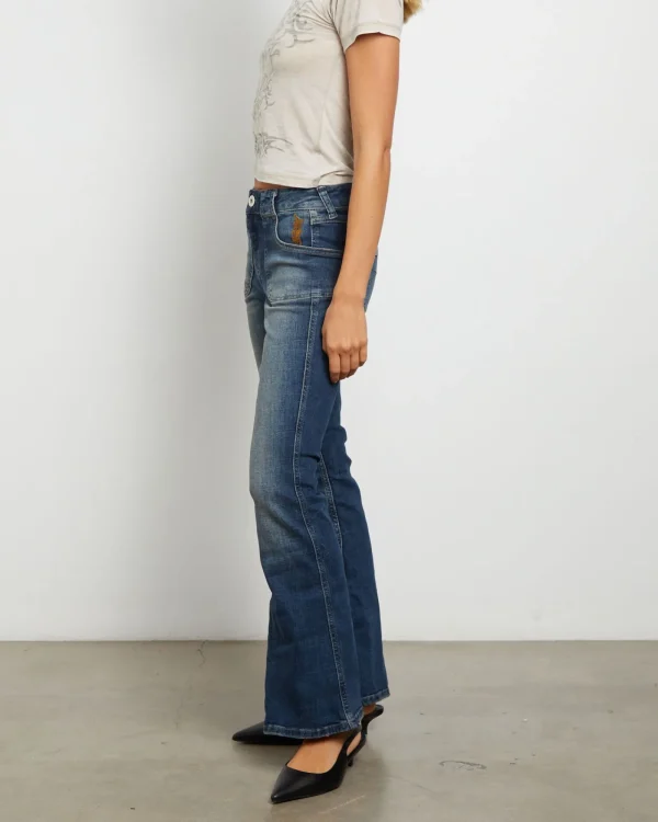 Shop BDG URBAN OUTFITTERS Bdg Tiana Low Rise Flare Jeans In Dark Vintage