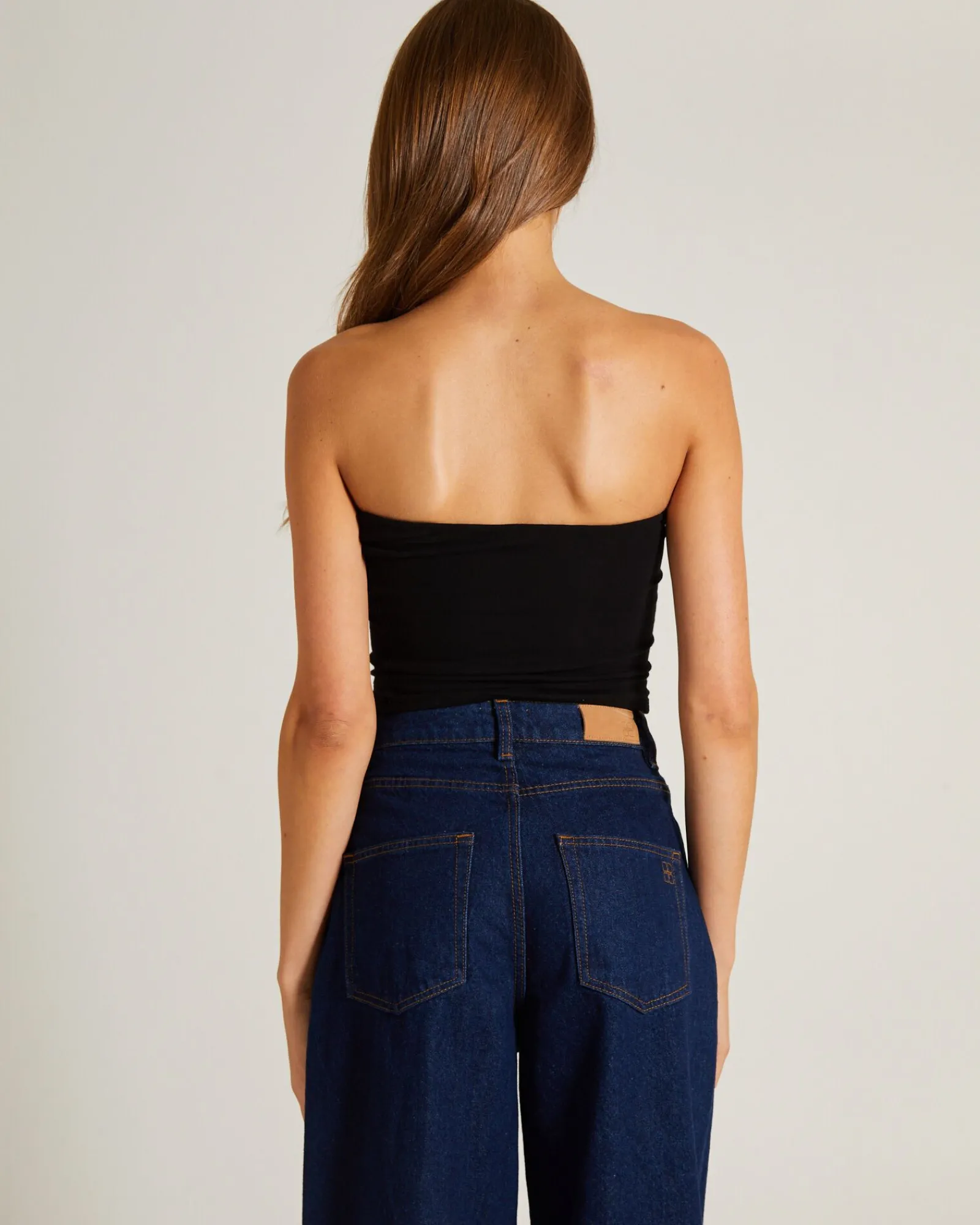 slinky_strapless_top_in_b_1.webp Store GENERAL PANTS CO. BASICS Slinky Strapless Top In Black