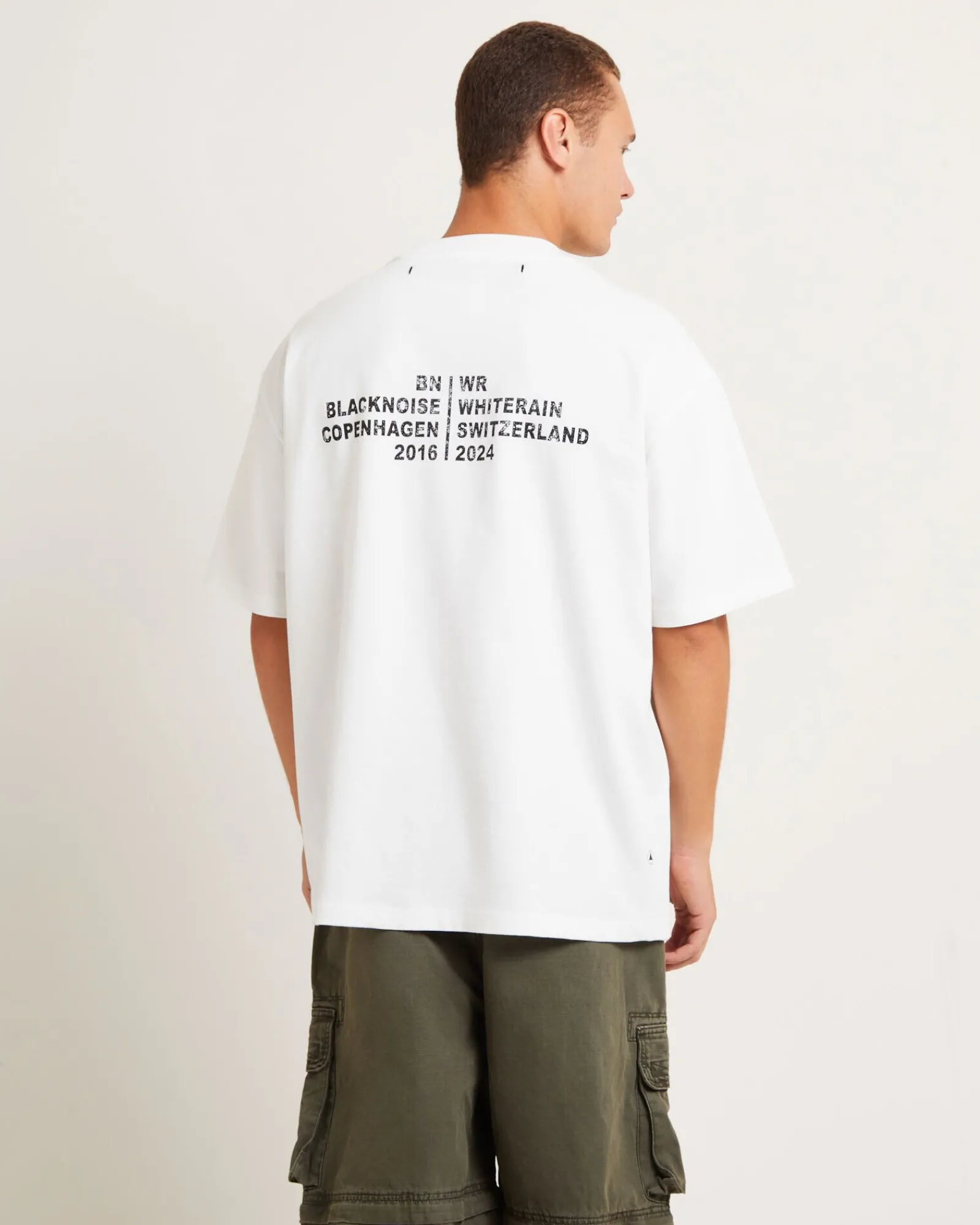 tour_short_sleeve_tshirt__1.webp New BLACK NOISE WHITE RAIN Tour Short Sleeve T-Shirt In White